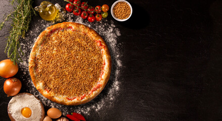 Obraz na płótnie Canvas Garlic Pizza. Top view on black concrete background, close up. Traditional Brazilian Pizza