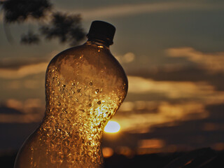 Plastic bottle pierced by the sun's rays