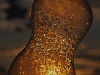 Plastic bottle pierced by the sun's rays