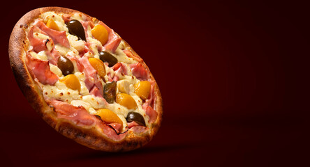 Sweet pizza with peaches, fig and pineapple on red background. Side view, close up. Traditional Brazilian Pizza