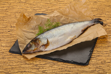 Salted herring over the wooden board