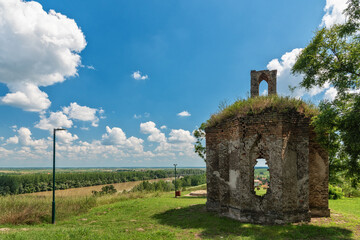 Titel, Serbia - June 25, 2020: Remains of old ruined monastery church on the hill above small town of Titel in Vojvodina, Serbia. Plateau of Titel