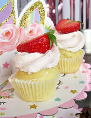 cupcakes close up with strawberry on top