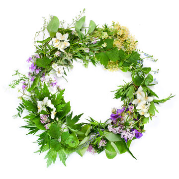 Beautiful flower wreath with colorful flowers isolated on a white background. Midsummer celebration concept, summer decoration.