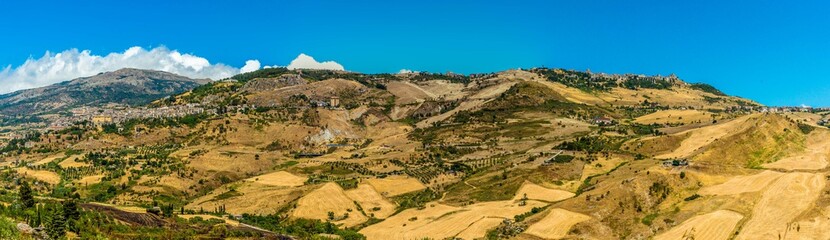 Panorama view of the twin hilltop settlements of Petralia Sottana and Petralia Soprana in the Madonie Mountains, Sicily during summer