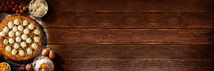 Pizza with broccoli, heart of palm and dried tomato. Top view, close up. Traditional Brazilian Pizza