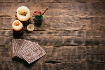 Tarot cards on the wooden table background with copy space.