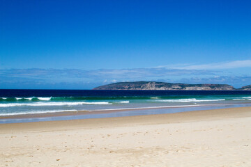 Seascape at Plettenberg Bay beach showing distant peninsula