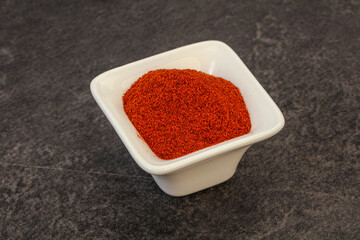 Dry paprika powder in the bowl