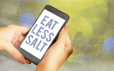 Handwriting text Eat Less Salt. Conceptual photo reducing the sodium intake on the food and...