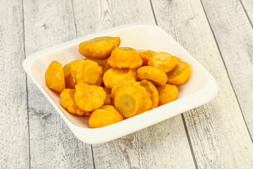 Marinated yellow patisson in the bowl