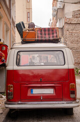 red car in front of a house
