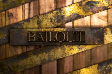 Bailout text formed with real authentic typeset letters on vintage textured silver grunge copper...