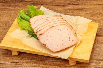 Boiled pork sausage over board