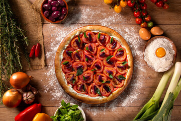 Pizza with tomato, olive and basil. Top view on wood background, close up. Traditional Brazilian Pizza