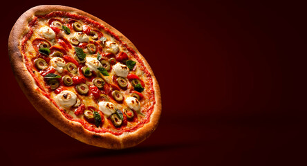 Brazilian pizza with tomato, cream cheese, olive and basil. Side view on red background, close up....