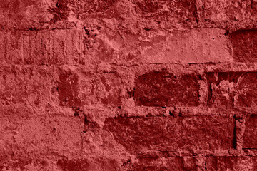 Closeup shot of wall of red old bricks with crack cement