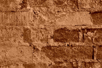 Closeup shot of wall of old Coffee color bricks with crack cement