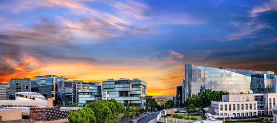 Naklejka premium Panorama of Sandton City at sunset with colourful clouds