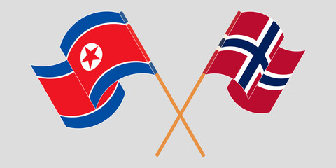 Crossed and waving flags of North Korea and Norway