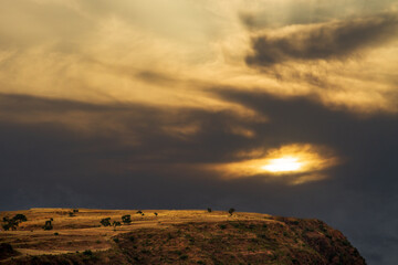Naklejka na ściany i meble The highlands of lalibela in Ethiopia with beautiful sunset