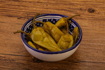 Marinated spicy and hot green pepper