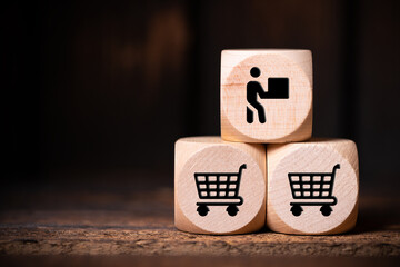 cubes with shopping icons on wooden background