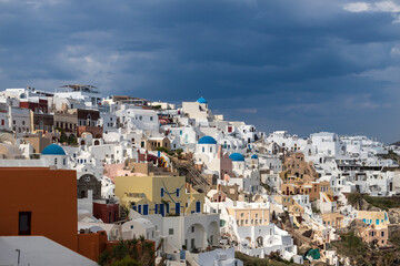 View of Oia city at sunrise. City on Santorini island in Greece.