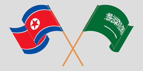 Crossed and waving flags of North Korea and the Kingdom of Saudi Arabia