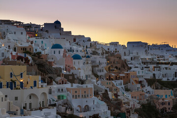 View of Oia city at sunrise. City on Santorini island in Greece.