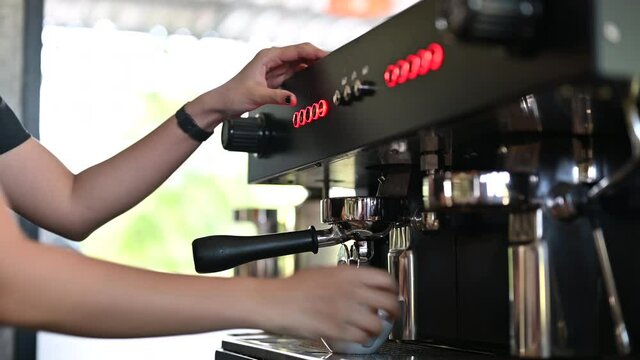Close up image of barista preparing coffee at cafe