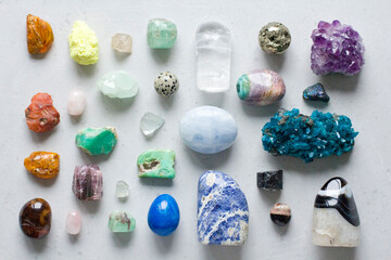 Beautiful bright multi-colored collection of natural stones and minerals from around world lies on...