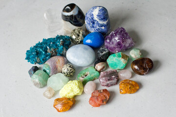 Beautiful bright multi-colored collection of natural stones and minerals from around world lies on...