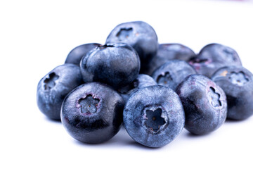 Blueberry macro image. Fresh sweet and ripe blueberry close up on white isolated background. Selective focused.