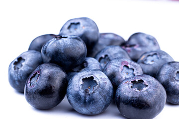 Blueberry macro image. Fresh sweet and ripe blueberry close up on white isolated background. Selective focused.