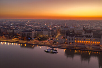 Fototapeta na wymiar Aerial drone shot of Kossuth square north Hungarian Parliament lights off before sunrise in Budapest dawn