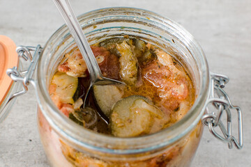 jam jar of ratatouille with vegetables in the kitchen interior
