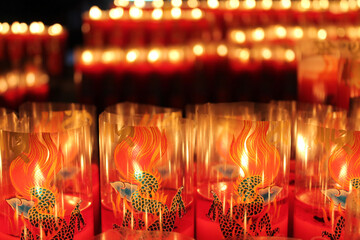 Lit candles with flame in temple in Taiwan 