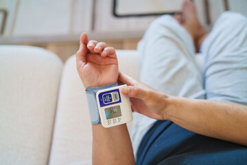 Patient measuring blood pressure. Hypertension