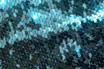 Sequins woman. Glamour fabric glitter background. Colorful mermaid sequins background.