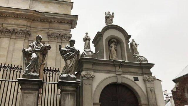 Krakow, Poland, A statue in front of a building