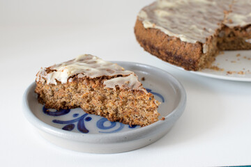 sliced carrot cake, served on a ceramic plate