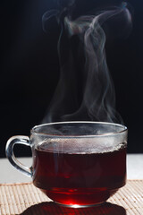 hot tea is poured into a mug