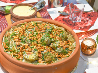 Mansaf (Arabic: منسف‎) is a traditional Arab dish made of lamb cooked in a sauce of fermented dried yogurt and served with rice