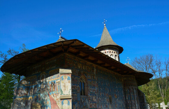 VORONET MONASTERY, BUCOVINA, ROMANIA, EUROPE, SPRING 2018. Orthodox monastery. Moldovan architectural style. Outdoor paintings, frescoes and portraits of saints with Byzantine influence.