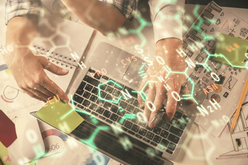 Obraz premium Double exposure of man and woman working together and formula hologram drawing. Computer background. Top View. Education concept.