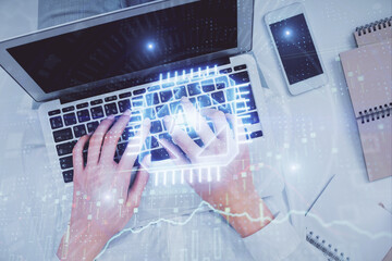 Double exposure of woman hands working on computer and data theme hologram drawing. Top View. Technology concept.