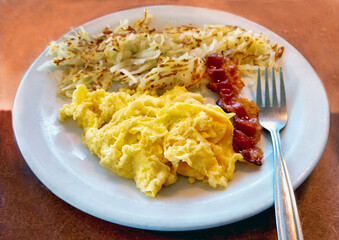 American Breakfast of bacon eggs and hash browns