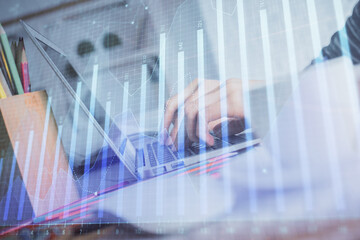 Double exposure of woman hands typing on computer and forex chart hologram drawing. Stock market invest concept.