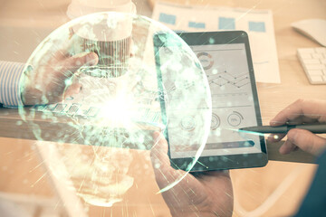 Double exposure of man's hands holding and using a phone and international business theme drawing.